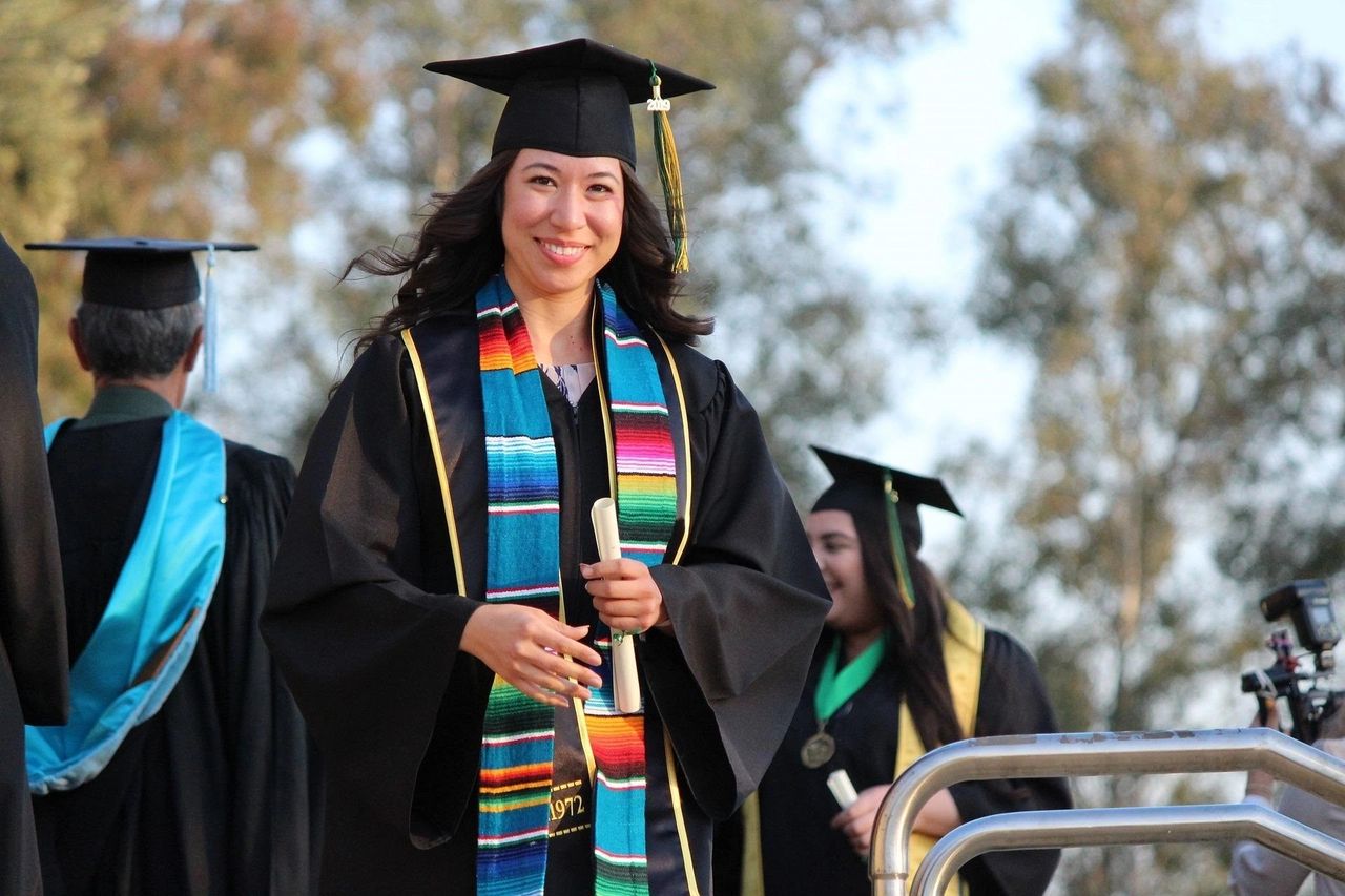 A photo of a woman who graduated in College.