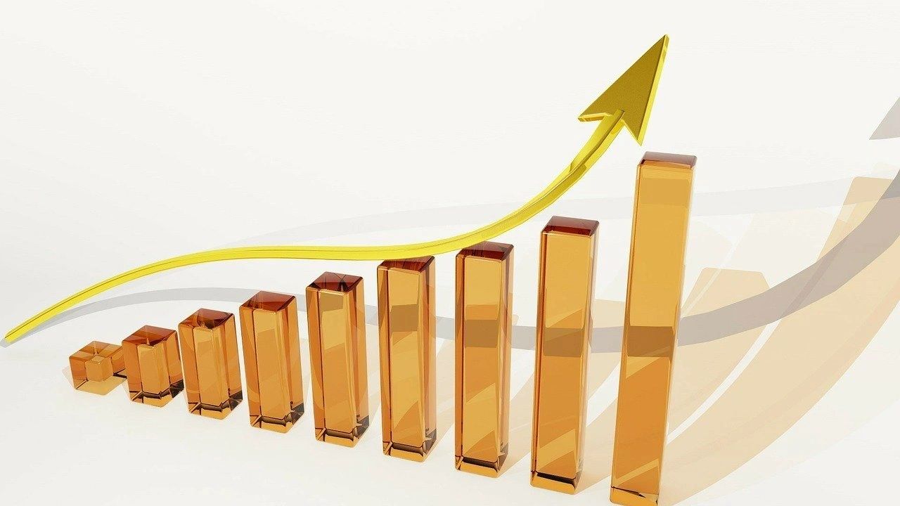 A visual or graphic of a graph with an arrow going up. 