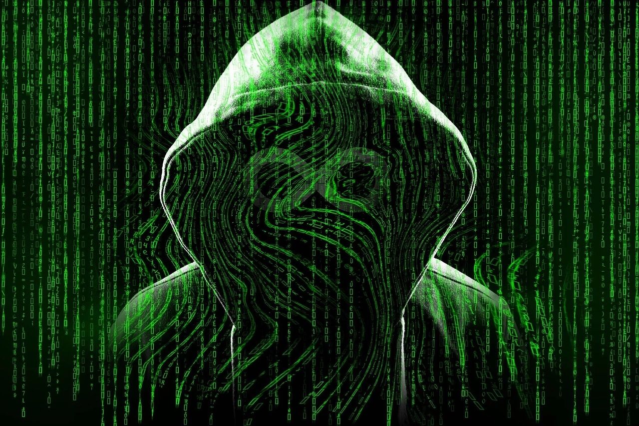 A photo of a guy in a hoodie, with an overlay of codes in green text, shadow, and highlight. 